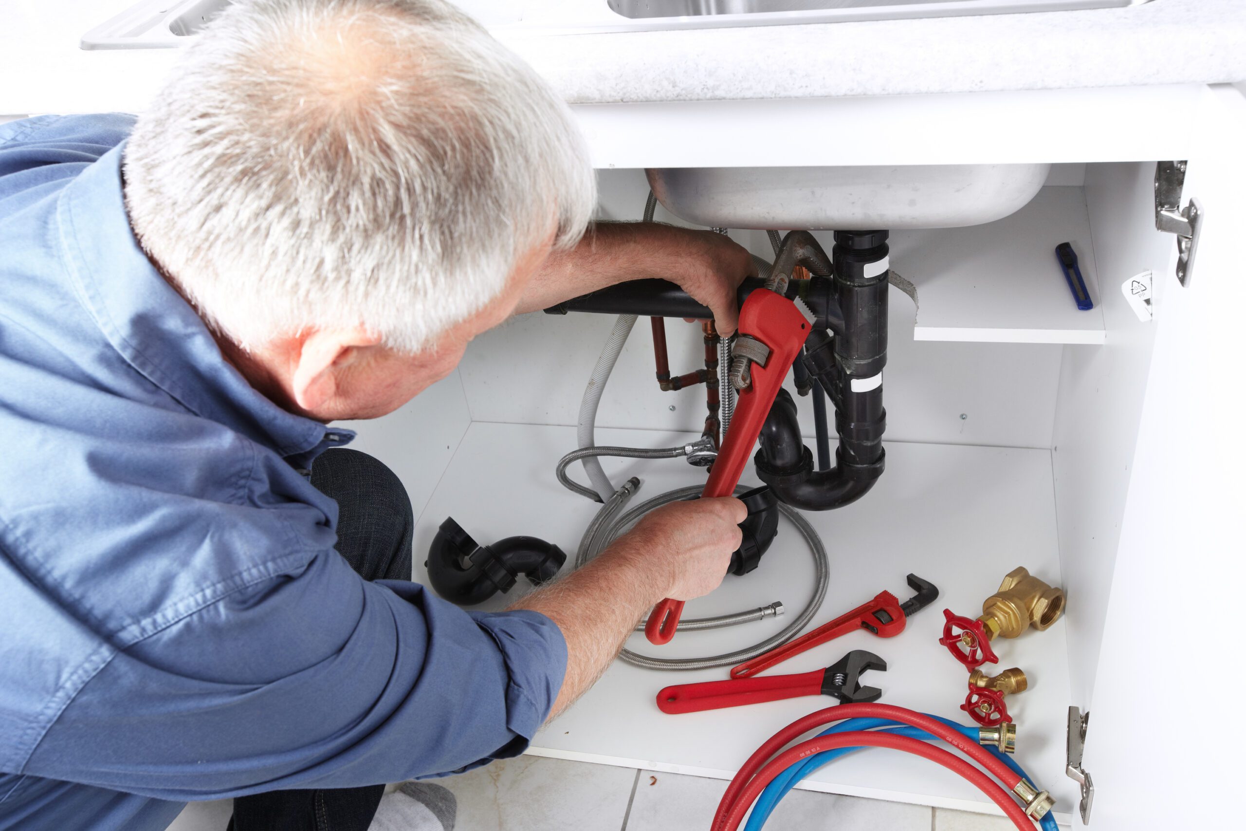 Master Plumber Fixing A Lavatory